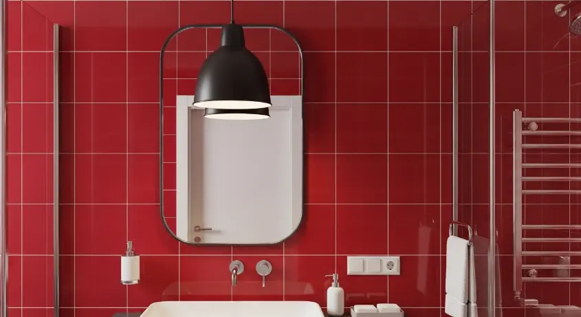 cherry red bathroom with a matte black pendant light
